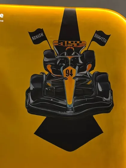 We transformed this space into a dynamic kids' room with a custom racing car theme. The bold yellow background and hand-painted Formula 1 car create an exciting and personalized environment for any young racing enthusiast.