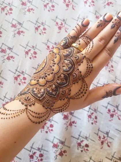 I did this festive mandala on myself for Diwali, trying to create a design that resembles a beautiful rangoli pattern.
