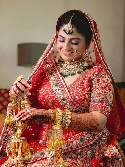 The pure joy of a bride on her wedding day. This client looks radiant in one of my Kundan and emerald sets, complete with matching kaleeras. Seeing my clients this happy is what my service is all about.