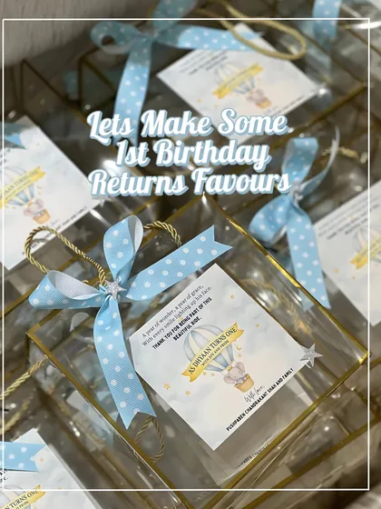 Assembling first birthday return favors is one of my favorite things to do. These transparent bags with custom tags and ribbons look so magical when they all come together.