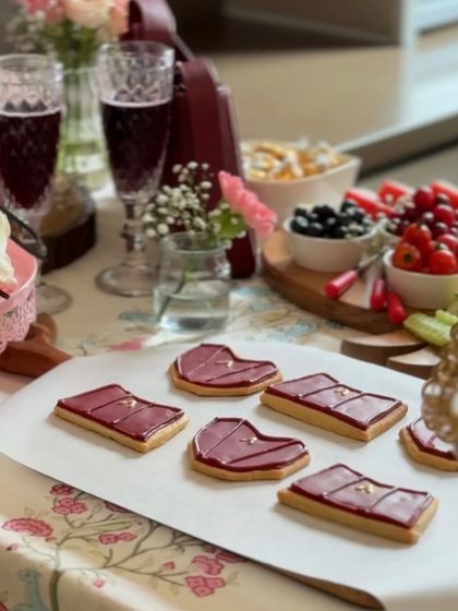 Our custom cookies laid out on a platter as part of a beautiful event spread. They make for a perfect, on-brand treat that guests always remember and talk about.