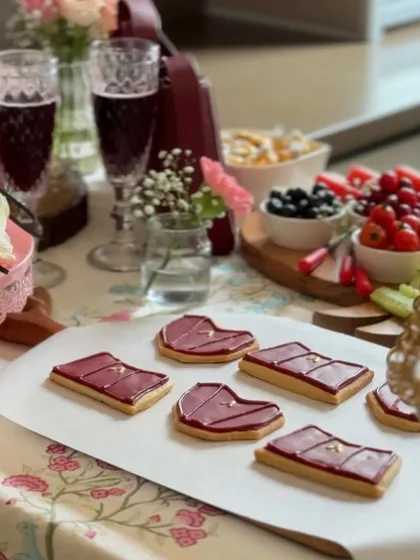 Our custom cookies laid out on a platter as part of a beautiful event spread. They make for a perfect, on-brand treat that guests always remember and talk about.