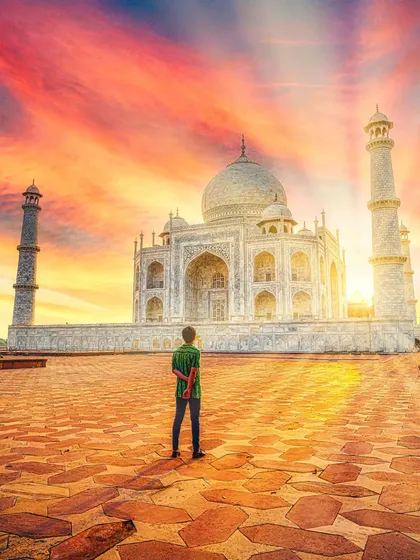 A solo portrait capturing the grandeur of the Taj Mahal during a fiery sunset. I edited the colors to enhance the dramatic sky, making the monument a co-star in the photo.