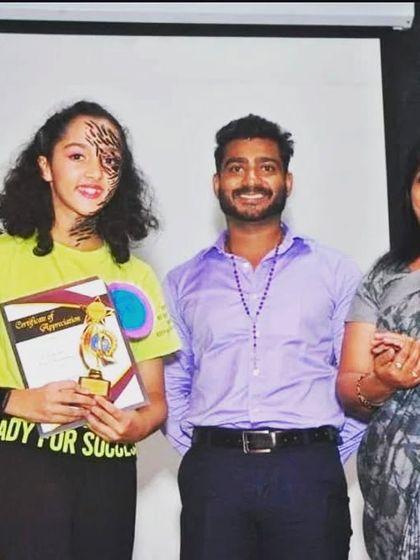 Posing with a talented winner of the dance competition. It's a proud moment for both the student and the mentor.