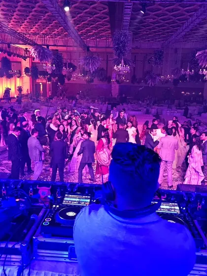 A view from my console overlooking a sea of guests at a pre-wedding party. My job is to control the energy of the entire room from this spot.