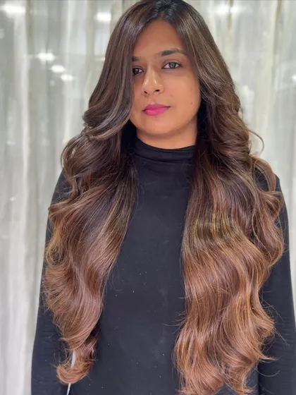 Rocking that rich brown hue. This client has incredibly long, thick hair, and the colour adds even more depth and dimension to her voluminous waves.