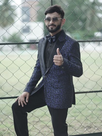 A full-length view of a formal hosting outfit. I always dress sharply to represent my clients' brands and events in the best possible light.