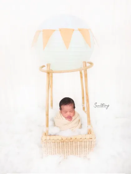 Up, up, and away! This hot air balloon setup is one of my most requested themes. With a clean white background and soft textures, it creates a whimsical and adventurous portrait while your little one is safely nestled in the basket.