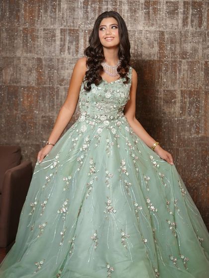 A vision in this pastel mint green gown. I created a soft glam makeup look with peachy glossy lips and gentle waves in her hair to complement the delicate, ethereal feel of her outfit.