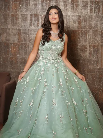 A vision in this pastel mint green gown. I created a soft glam makeup look with peachy glossy lips and gentle waves in her hair to complement the delicate, ethereal feel of her outfit.