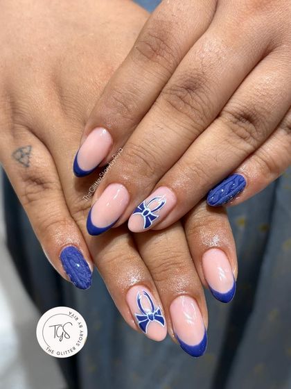 A full view of the cozy sweater nail set, showing the combination of the 3D cable-knit texture and the clean, blue French tips.