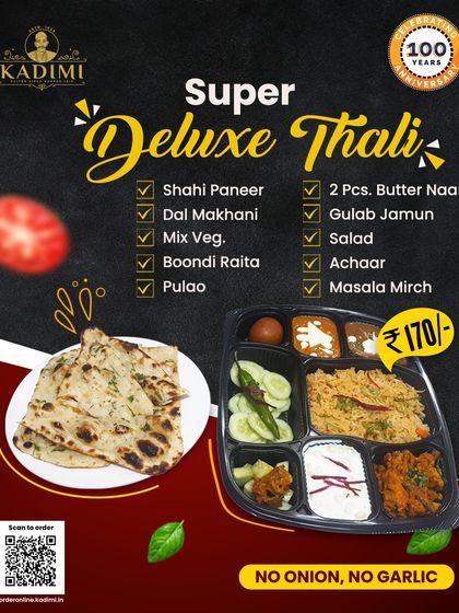 This is our Super Deluxe Thali, a feast in itself. It includes Shahi Paneer, Dal Makhani, Mix Veg, Pulao, Raita, Butter Naan, and a Gulab Jamun for a sweet finish.