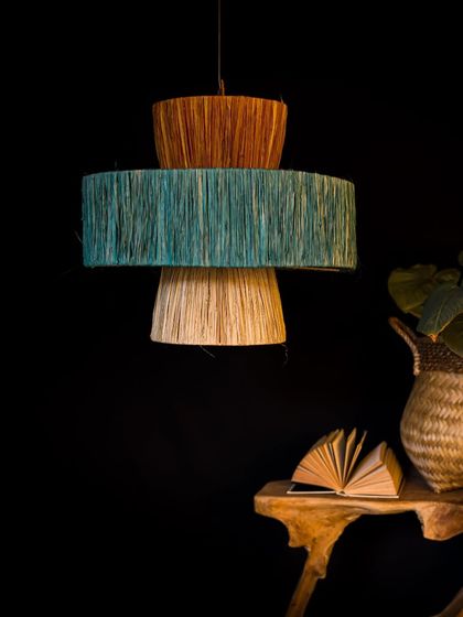 This tiered fiber lamp features earthy tones of terracotta, teal, and natural beige. It’s a wonderful way to introduce subtle color and texture into a neutral space.