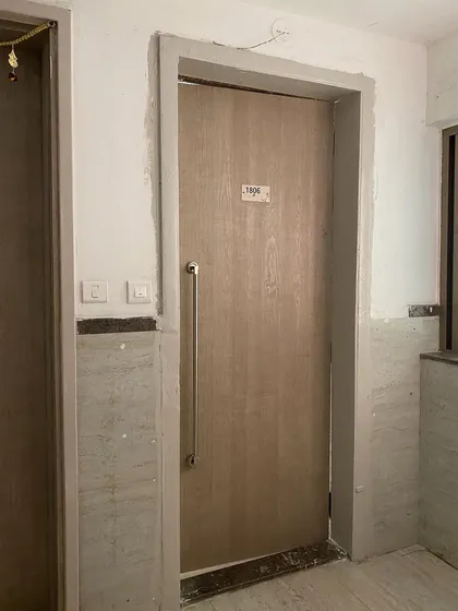 A standard apartment door before our intervention.