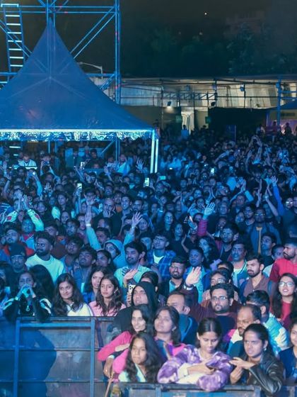 A shot of the packed fan pit, showing the energy and excitement right at the front of the stage. I design event layouts that maximize crowd engagement and create an intense, up-close experience.