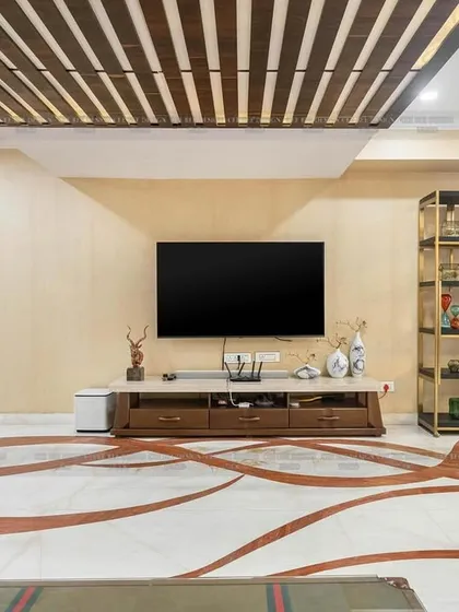 A shot of the living room from image 112, focusing on the intricate marble floor inlay and the slatted wood ceiling design.