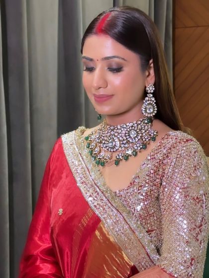 Vaishali's reception look was effortlessly flawless. I paired a classic red lip with a soft smokey eye and a luminous base to create a glamorous yet timeless look.