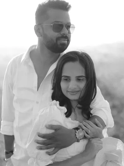 A stylish black and white portrait from an outdoor pre-wedding session, giving it a classic and sophisticated feel.