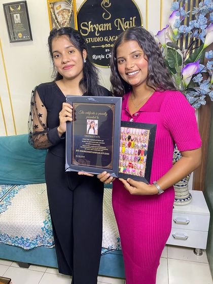 This student is graduating with her certificate and a full portfolio of her work, ready for her career.