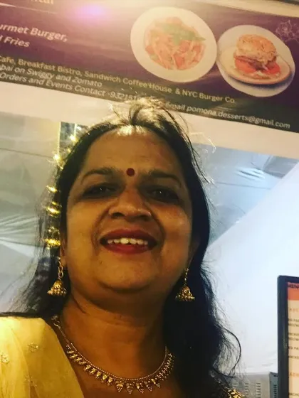 Here I am at our stall during the Chembur Durga Puja. I believe in being personally involved to ensure the quality of food and service at every event I cater.