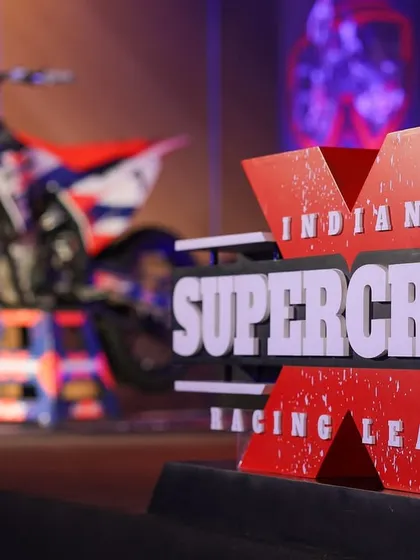 A close-up of the Indian Supercross Racing League logo on stage before the auction. This shot highlights the quality and detail of our event branding.