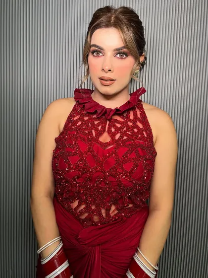 The client looks absolutely radiant in her bold red attire.