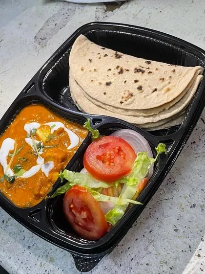 Enjoy a perfectly balanced meal with our portion-controlled thali. This one features a delicious paneer curry, soft whole wheat chapatis made from fresh chakki atta, and a crisp side salad.