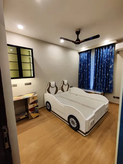 A fun and imaginative kids' bedroom featuring a custom-built car bed. We believe children's rooms should inspire creativity, and this project shows how we can bring any theme to life with bespoke furniture and thoughtful design.