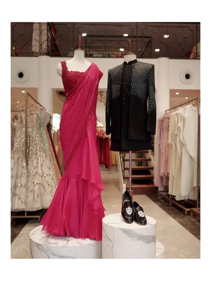 For cocktail evenings, I love creating looks that are both festive and refined. This pairing of a sculpted, draped saree for her and a sharply tailored bandhgala for him makes a powerful statement. It showcases how coordinated styling can create a memorable and sophisticated presence.