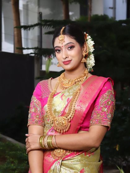 A classic portrait pose. The makeup is designed to create a radiant and timeless look for any South Indian bride.