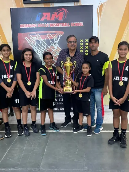Results speak for themselves. Here’s our Under 14 girls' team after winning the District Basketball Championship. We train our players to compete and win.