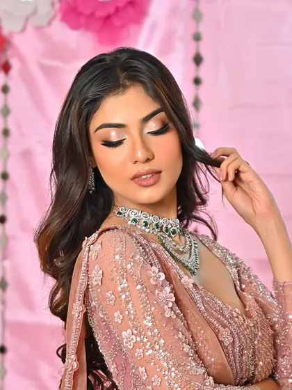 Radiating that effortless glow. This soft pink look is perfect for an engagement party or a daytime wedding event.