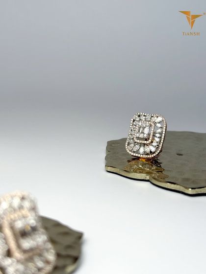 This diamond cluster earring stud brings the discipline of design and the poetry of light into one timeless piece. The geometric shape is both modern and classic.