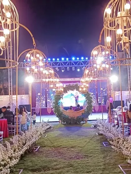 The stunning outdoor setup for a 25th-anniversary party. The lighting and decor created a truly magical ambiance for the evening.