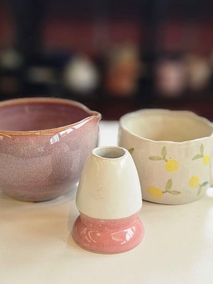 A custom matcha tea set, including a pink chawan (tea bowl), a whisker stand, and a hand-painted mug. I love making these sets in colors chosen by the client.