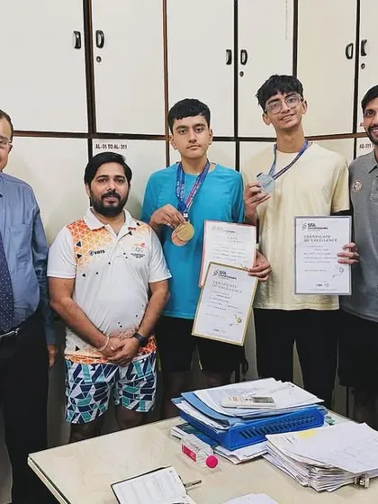 Adrian Lobo and Puranjay Gupta being felicitated by the academy officials for their achievements at the SFA Championship.