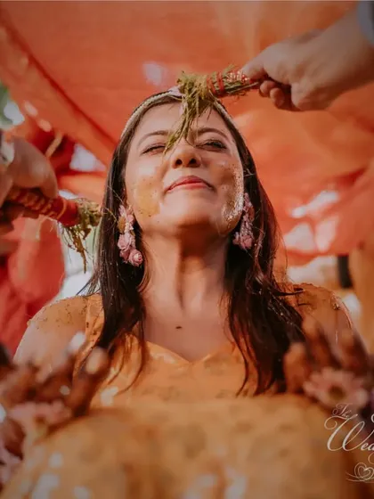 A moment of blessing during the Haldi ceremony. Amidst all the fun, I ensure the sanctity and tradition of the rituals are beautifully maintained.