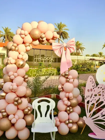 A beautiful, well-lit shot of the complete butterfly theme setup, perfect for capturing those precious first birthday memories.