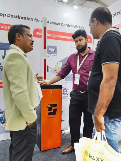 Another angle of our team discussing the functionality of our boom barrier with attendees at the Autosec Expo in Kerala.