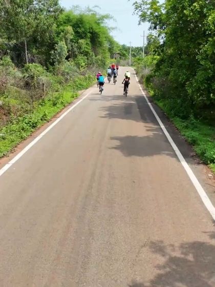 An aerial shot of a group of cyclists on a quiet country road. This shows the fun, social aspect of our guided tours.