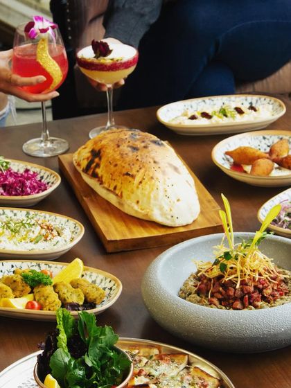 A feast for your eyes, camera, and palate. We believe in creating beautifully plated dishes, like this lavish spread of Turkish and Mediterranean mezzes, that awaken all your sensory experiences.