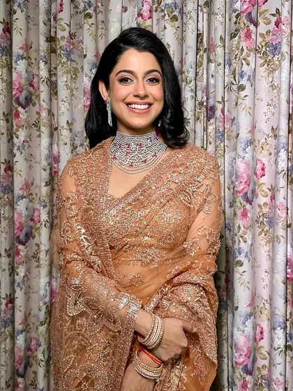 Elegance with a touch of vintage charm. For her cocktail event, this stunning bride embraced a look as timeless as her grace with flushed cheeks, a flicked eyeliner, and a classic retro hairstyle.