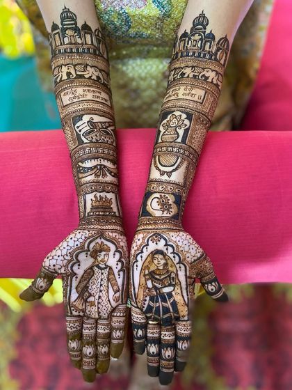 Another view of the royal story mehandi, showing the intricate details of the elephants, moon, and other symbols that tell the couple's story.