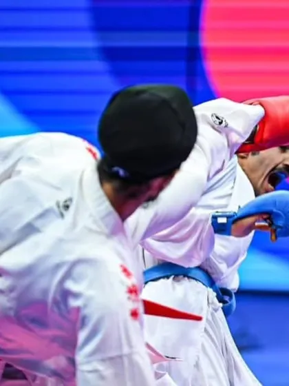 A close-up action shot from the World Karate Federation (WKF) coverage of the Asian Championship. Every match is a physical and mental chess game.