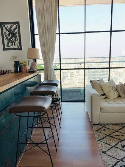 Parineeti Chopra wanted her home to feel like a hug after a long day. We kept the design minimal yet layered, with clean lines, monochrome tones, and cozy textures. The bar area, with its view of the city, is a perfect example of this balanced, calm aesthetic.
