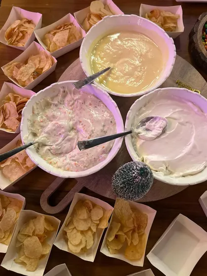 A chips and dips station is a must-have for any party. I provide a variety of chips and freshly made dips, like cheese sauce and creamy herb dip.