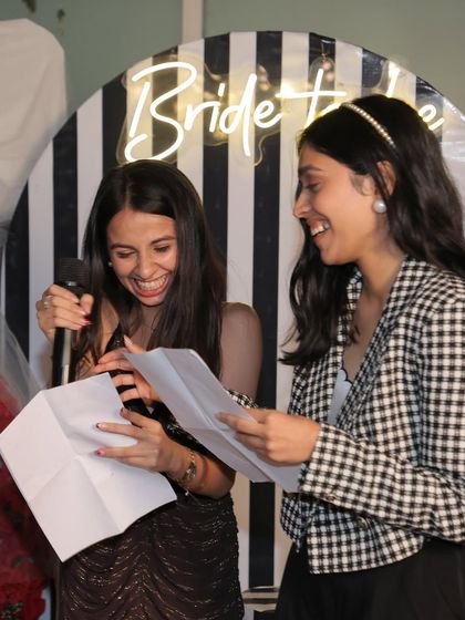 Guests laughing while playing one of the many fun games we had planned for the evening.