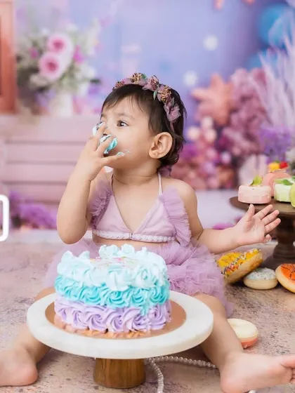 A sweet taste of birthday cake for this little mermaid. These sessions are as much about the sensory experience for the baby as they are about the photos.