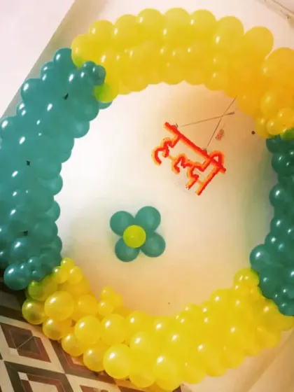 A simple ring decoration for a Haldi or Mehendi function. The yellow and green balloons with a small "Haldi" cutout in Hindi create a traditional feel.