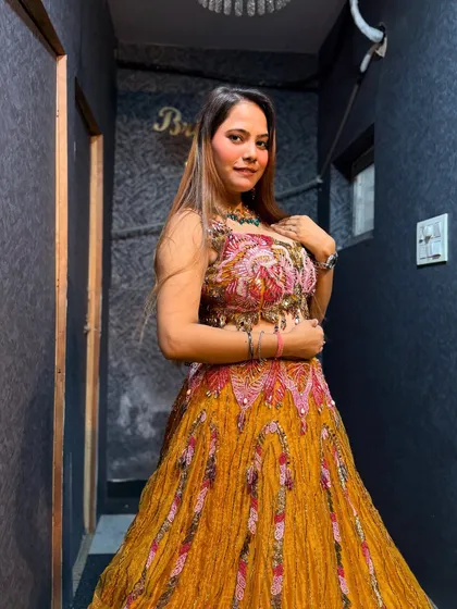 A close-up of our popular yellow Haldi lehenga. The intricate blouse work and vibrant color are perfect for the occasion.